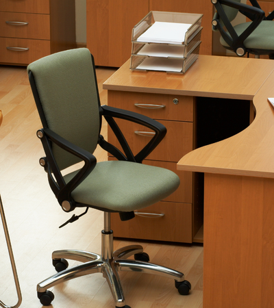 Empty desk and chair illustrating the cost of understaffing and lost business capacity